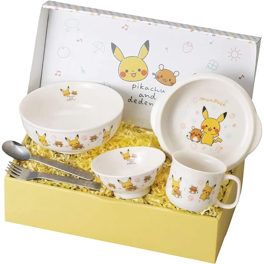 White ceramic Pokémon Monpoke tableware gift set with Pikachu and Dedenne designs, including bowls, mug, plate, and stainless steel utensils in a yellow box.