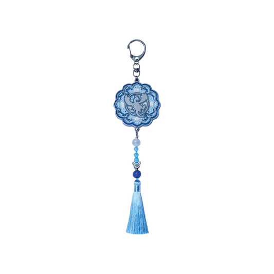 Lugia Pokémon keychain in celadon blue with traditional Korean patterns, decorative beads, and a matching tassel.