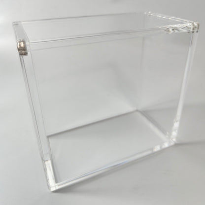 Clear acrylic display case for a booster box, featuring a 2-piece top-opening design with magnetic closure.