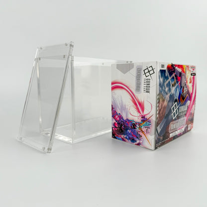 Clear acrylic display case with a magnetic lid, shown next to a Gundam TCG booster box.