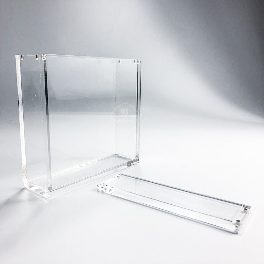 Clear acrylic display case for TCG booster boxes, featuring a 2-piece design with magnetic closure.