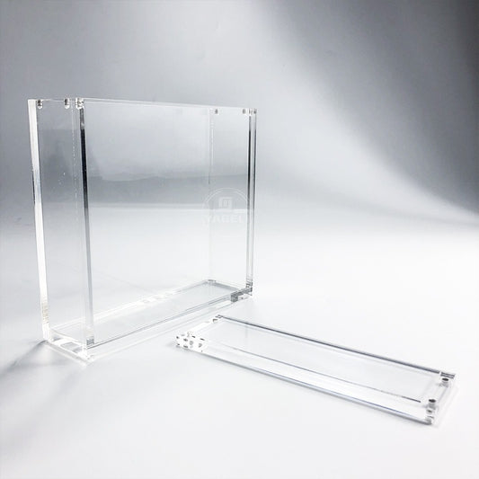 Clear acrylic display case for TCG booster boxes, featuring a 2-piece design with magnetic closure.