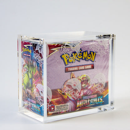 Clear acrylic display case protecting a colorful Pokémon booster box.