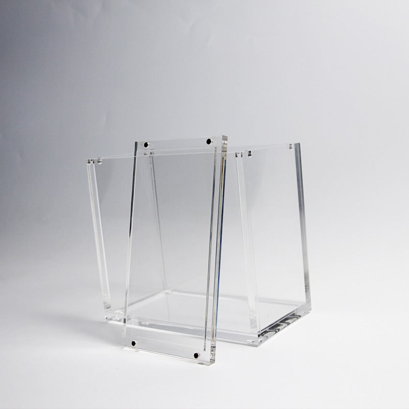 Clear acrylic display case for TCG booster boxes, featuring a 2-piece top-opening design with magnetic closure.