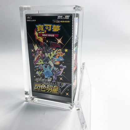 Clear acrylic display case with a black TCG booster box, featuring a magnetic top closure.