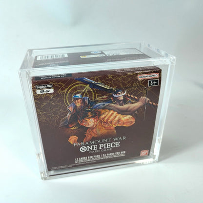 Clear acrylic display case protecting a One Piece TCG booster box, featuring magnetic closure and UV protection.