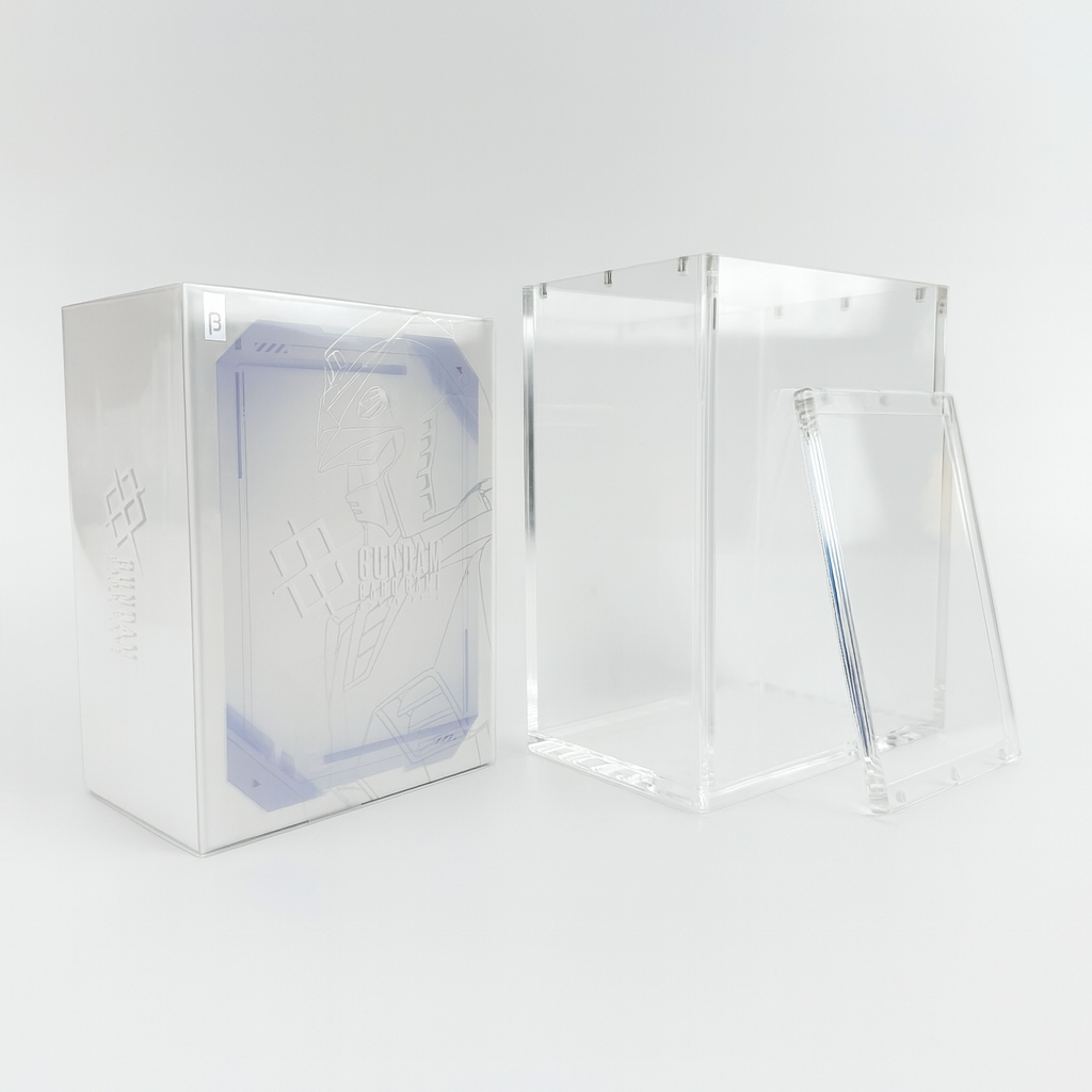 Clear acrylic display case for Gundam Card Game Beta booster box with a magnetic top-opening lid and UV protection.