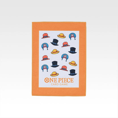 One Piece Card Game Prize F towel featuring a white center with colorful character hat icons and an orange border.