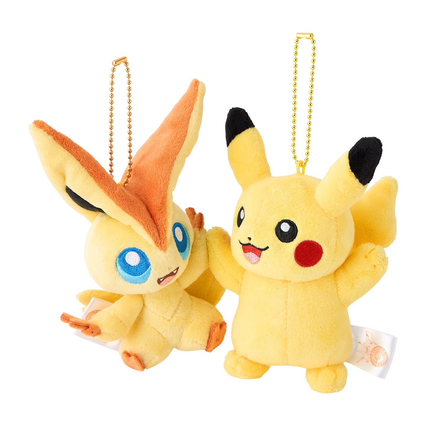 Yellow Pikachu and orange Victini plush toys with gold ball chains and built-in magnets for connecting together.