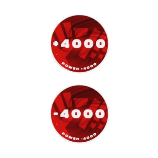 Two round red acrylic One Piece Card Game tokens, one showing "+4000 Power" and the other "-4000 Power".