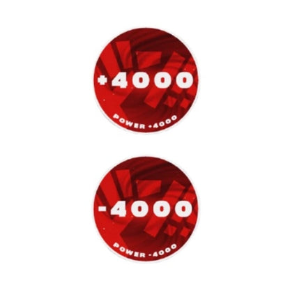 Two round red acrylic One Piece Card Game tokens, one showing "+4000 Power" and the other "-4000 Power".