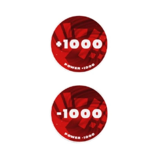 Two round, red acrylic One Piece Card Game tokens: one showing "+1000 POWER" and the other "-1000 POWER.