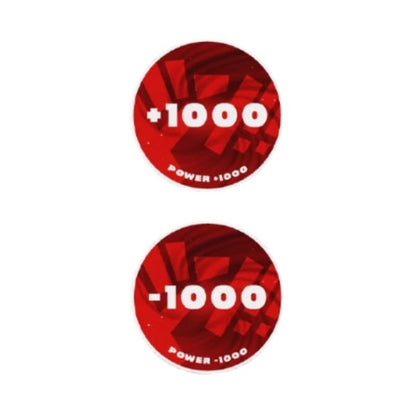 Two round, red acrylic One Piece Card Game tokens: one showing "+1000 POWER" and the other "-1000 POWER.
