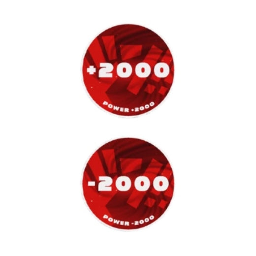 Two round red acrylic One Piece Card Game tokens, one showing "+2000 Power" and the other "-2000 Power.