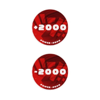 Two round red acrylic One Piece Card Game tokens, one showing "+2000 Power" and the other "-2000 Power.