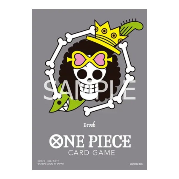 Matte grey One Piece card sleeve featuring Brook’s skull Jolly Roger design with a yellow crown and green accents.