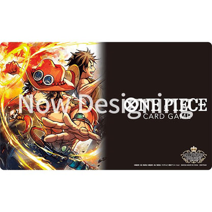 One Piece Card Game playmat featuring Ace and Luffy on a fiery background, with a black section for the game logo.