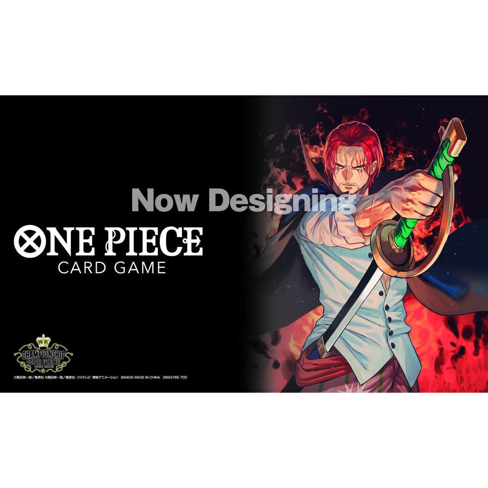 One Piece Card Game playmat featuring Shanks with a sword, black background, and "Now Designing" text.