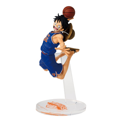 Monkey D. Luffy figure wearing a blue NBA jersey, dunking a basketball on a clear stand with a straw hat on his back.