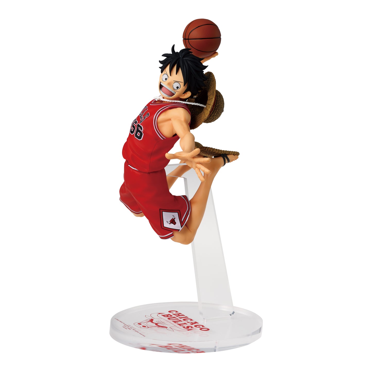 Monkey D. Luffy figure in a red Chicago Bulls jersey performing a basketball dunk on a clear display stand.