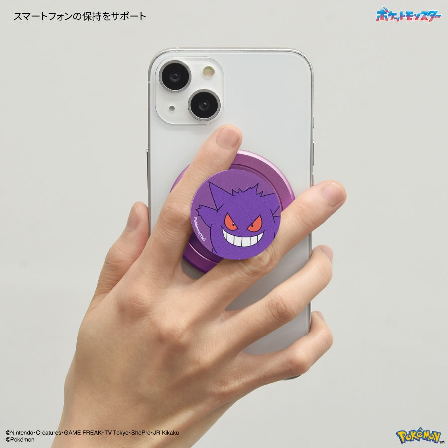 Purple Gengar Pokémon CHIP-POP magnetic smartphone grip and stand attached to the back of a white iPhone.