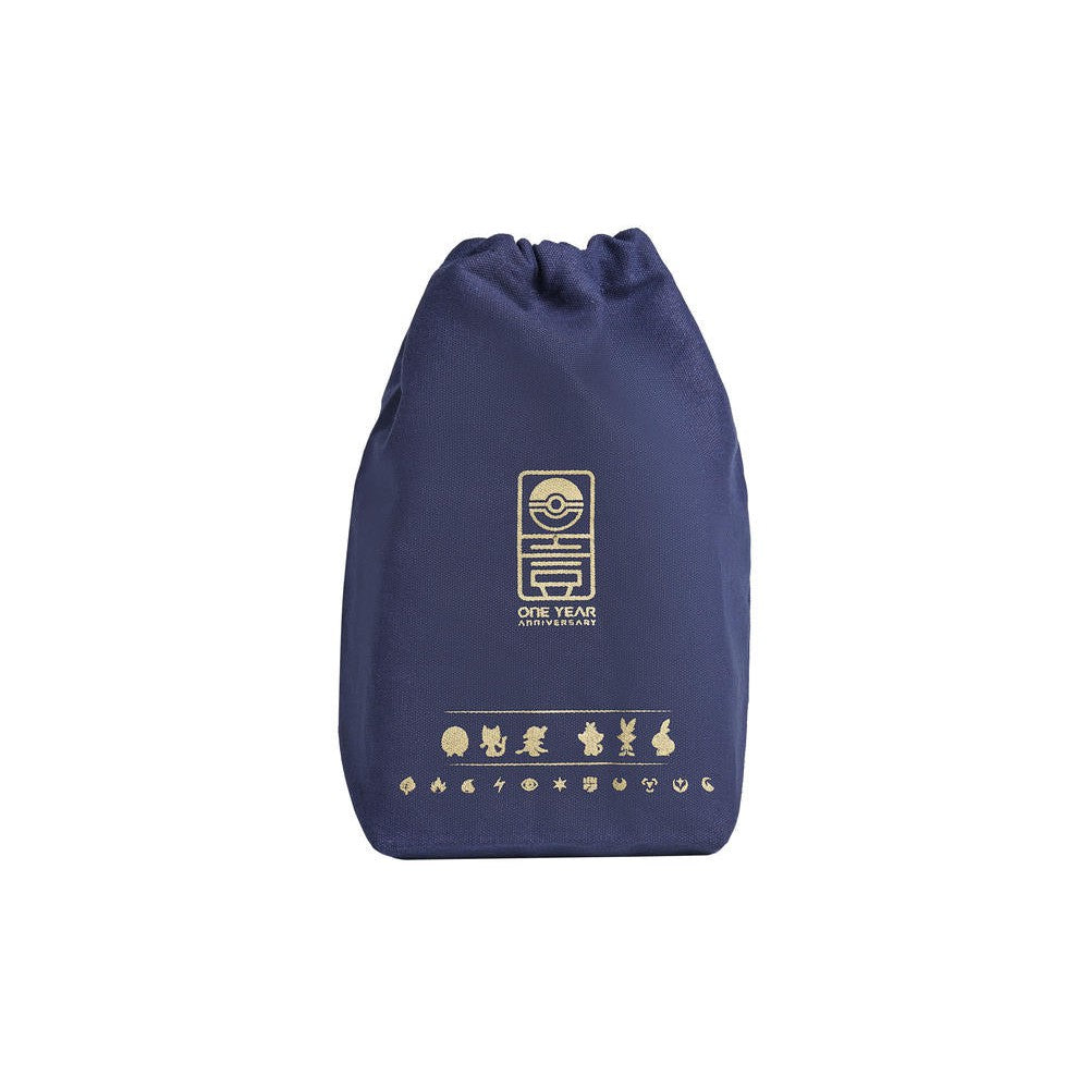 Dark blue cloth drawstring bag with gold "ONE YEAR ANNIVERSARY" Pokémon logo and character icons.