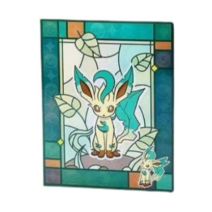 Pokémon 9-pocket card binder featuring a teal stained-glass design with Leafeon and leaf motifs.