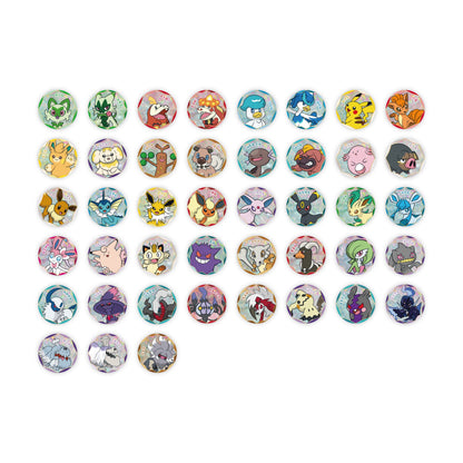 Collection of circular Pokémon Gem Pack badges featuring colorful character illustrations on a shimmering, faceted background.