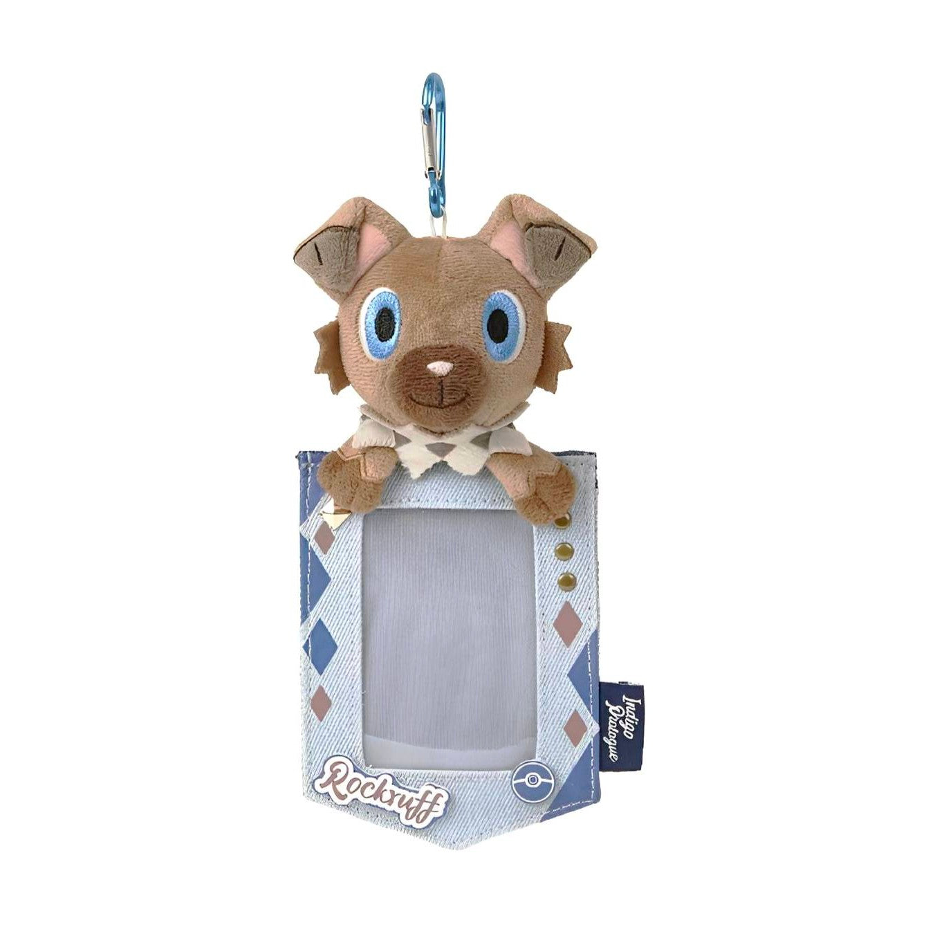 Rockruff plush keychain with a light blue denim-style Pokémon card display holder and a silver carabiner clip.