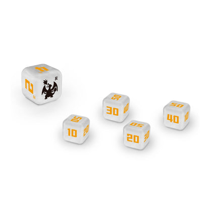 White Pokémon damage counter dice with orange numbers and a black Charizard icon on a textured surface.