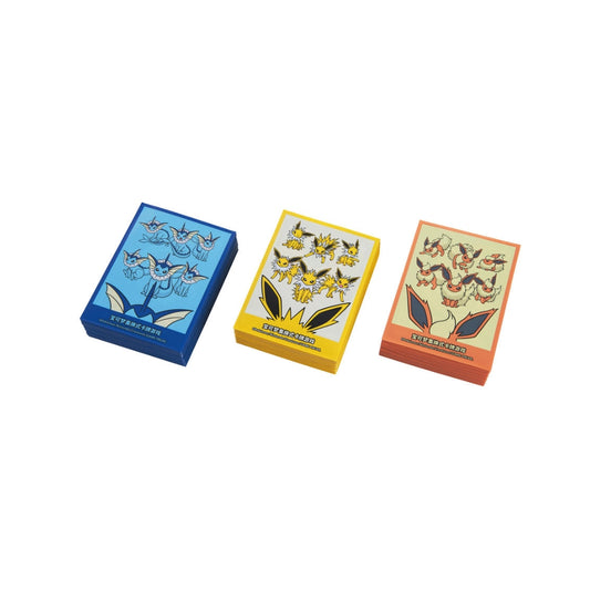 Three stacks of Eeveelution Pokémon card sleeves in blue, yellow, and orange with character illustrations.