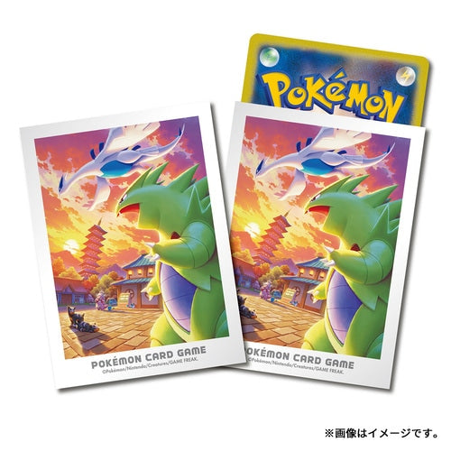Set of 64 Pokémon card sleeves featuring Lugia and Tyranitar in a vibrant Johto sunset landscape design.