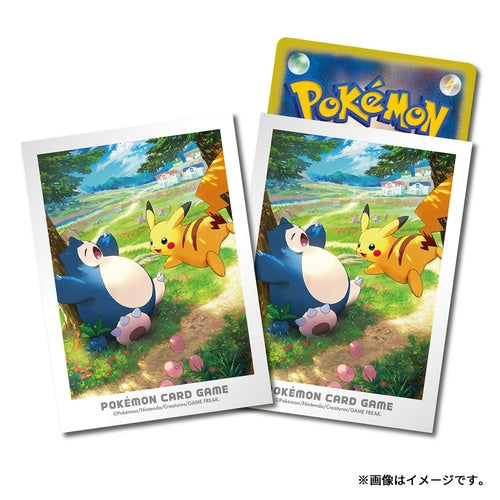 Pokémon card sleeves featuring Pikachu and Snorlax in a sunny meadow, set of 64 protective plastic card protectors.