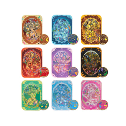 Nine Pokémon Terastal Festival accessory sets featuring Eeveelutions with matching metallic storage cases and magnetic plates.