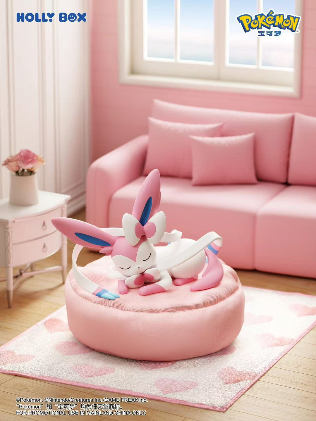 Sylveon sleeping on a round, soft pink beanbag cushion, designed as a plush wrist rest in a cozy pink room.