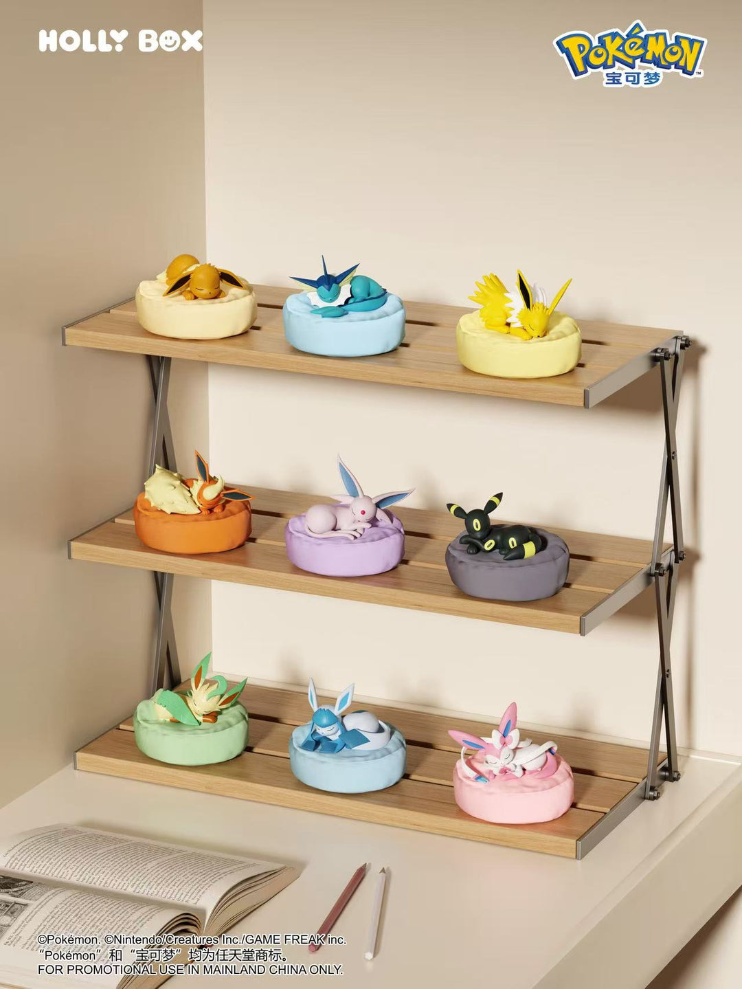 Nine Pokémon Eeveelution figures sleeping on colorful, soft-textured beanbag cushions displayed on a wooden shelf.