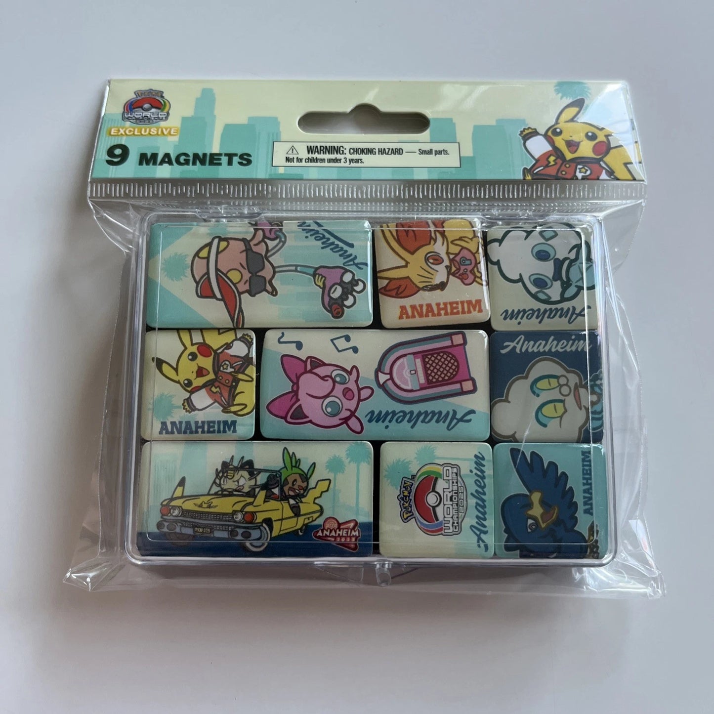 Nine rectangular Pokémon 2025 WCS magnets featuring colorful character illustrations and Anaheim branding in retail packaging.