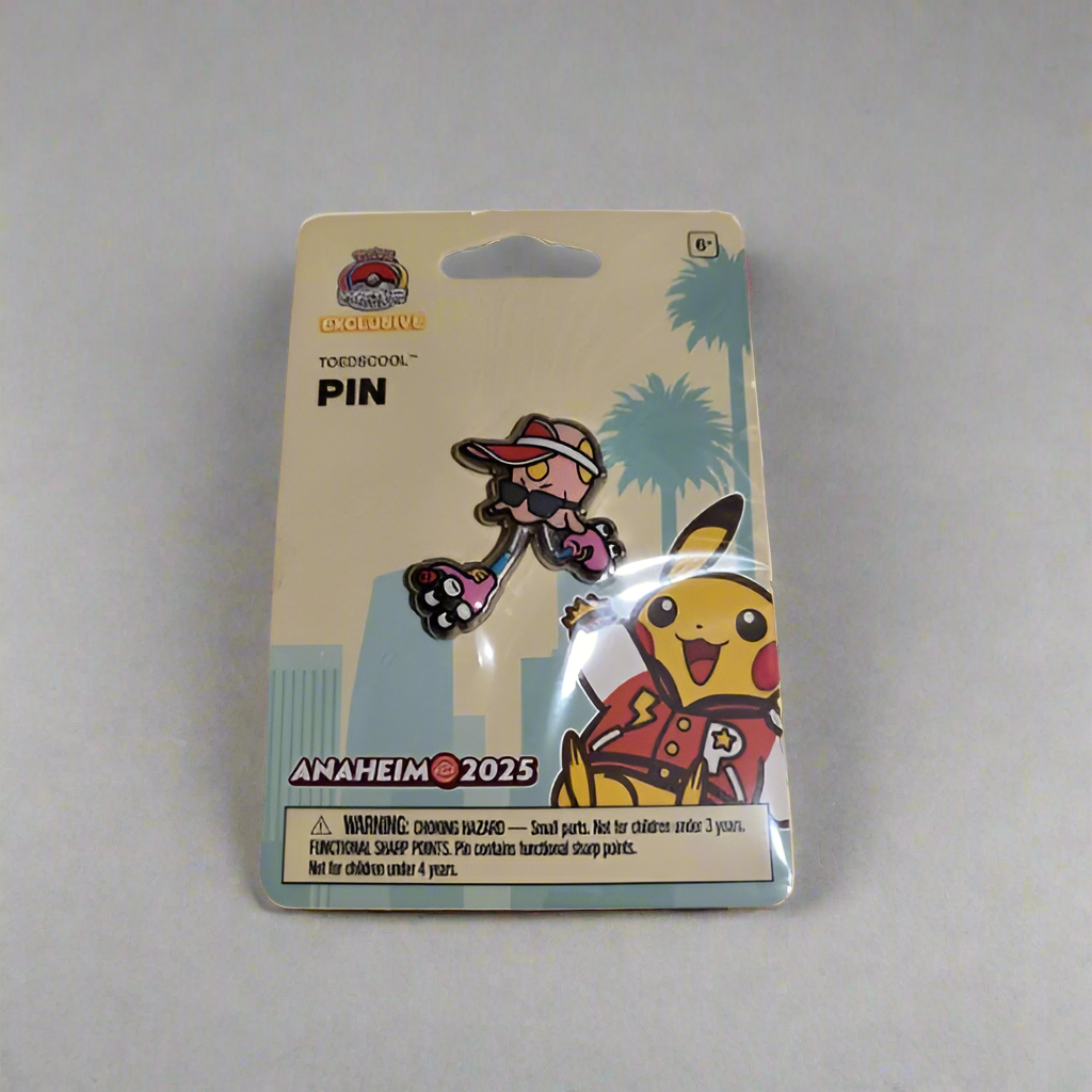 Toedscool enamel pin in 2025 WCS Anaheim packaging featuring a pink mushroom Pokémon wearing a red cap and sunglasses.