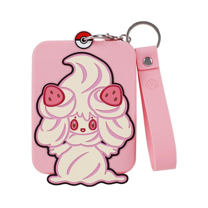 Pink silicone Pokémon Alcremie display with a card protective case and keychain.