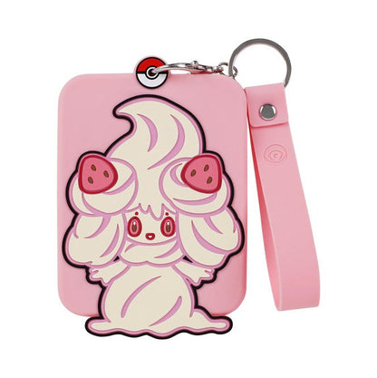 Pink silicone Pokémon Alcremie display with a card protective case and keychain.