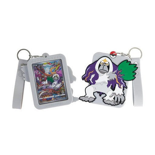 Two gray Pokémon silicone displays; one holds a colorful card, the other is a white and purple Oranguru.