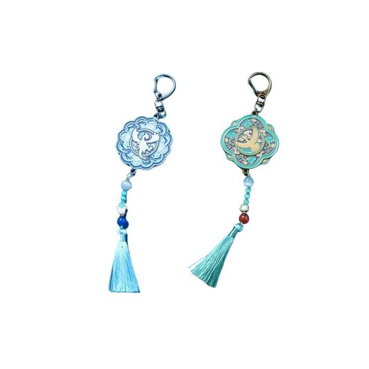Lugia and Ho-oh Pokémon keychains with traditional Korean patterns, celadon blue tones, and elegant decorative tassels.