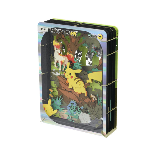 3D Pokémon Paper Theater kit featuring a layered Pikachu EX card design with laser-cut paper forest scenery.