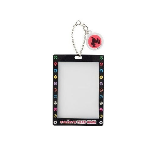 Black Pokémon Card Game key chain with clear card holder and a red flame energy charm.