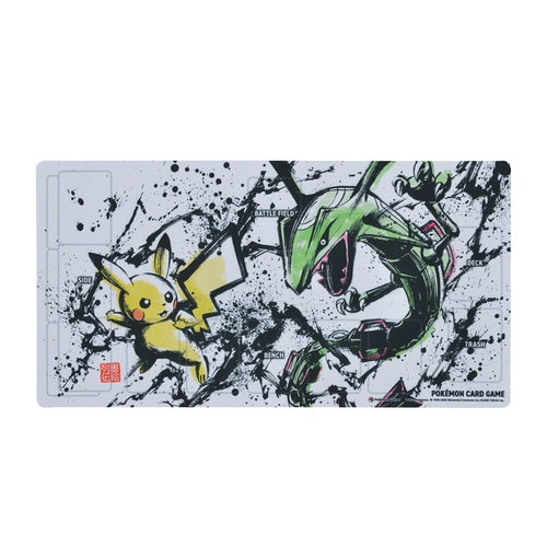 White Pokémon TCG playmat with ink-style Pikachu and Rayquaza art, card zones, and rubber backing.